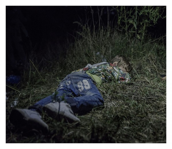EXCLUSIVE, SPECIAL FEES APPLY. Must Credit - Magnus Wennman/Rex Mandatory Credit: Photo by Must Credit - Magnus Wen/REX Shutterstock (2853832c) Ahmed, 6, sleeping on the ground in Horgos, Serbia Magnus Wennman: Where the children Sleep - 27 Sep 2015 It is after midnight when Ahmed falls asleep in the grass. The adults are still sitting around, formulating plans for how they are going to get out of Hungary without registering themselves with the authorities. Ahmed is six years old and carries his own bag over the long stretches that his family walks by foot. "He is brave and only cries sometimes in the evenings," says his uncle, who has taken care of Ahmed since his father was killed in their hometown Deir ez-Zor in northern Syria.